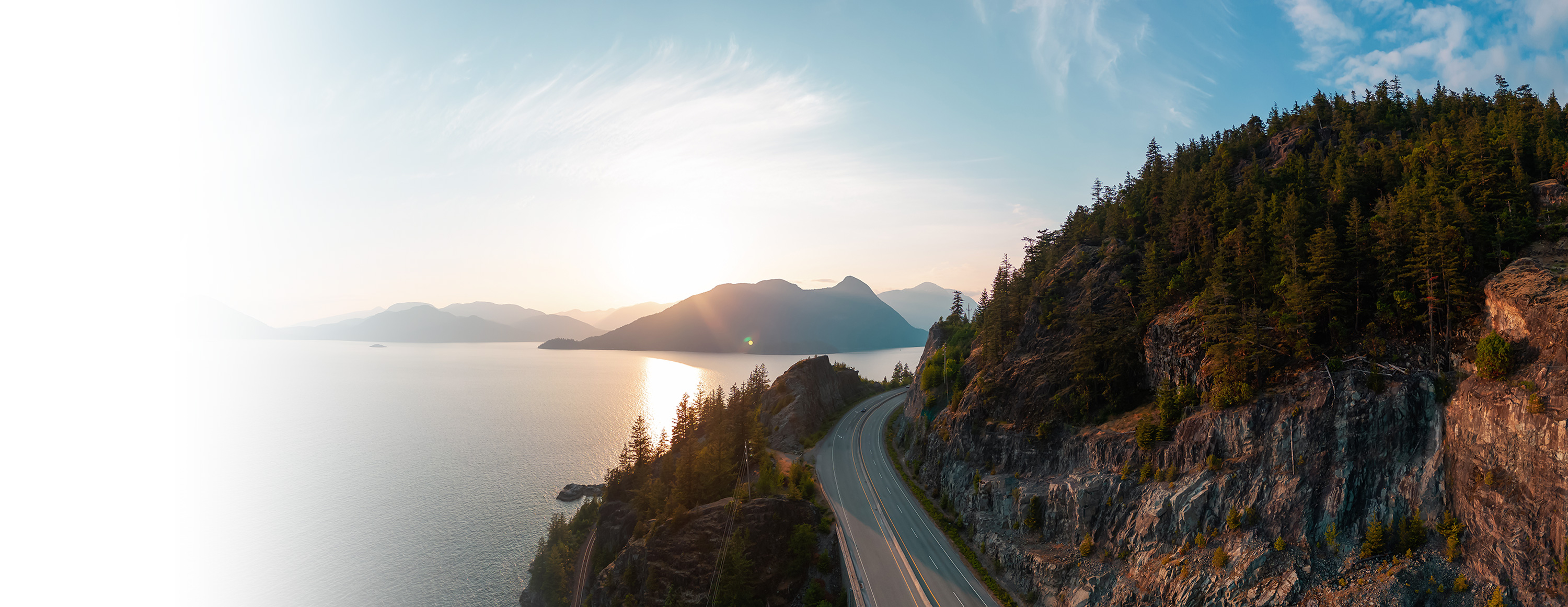 Sea to Sky Highway with Pacific Ocean and sunset in distance